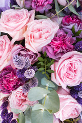 Gorgeous bouquet of roses and carnations with decorative dried flowers.