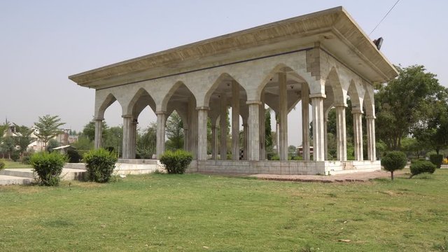 Multan Shah Shams Park Pavilion Side View at Eidgah Road with Clipped Hedges on a Sunny Blue Sky Day