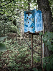 Rusty postbox in Pripyat city, Chernobyl Exclusion Zone, Ukraine (inscription: post)