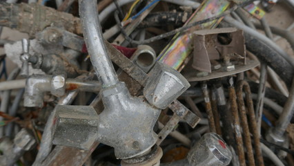  Scrap and old rusty metal waste, residual waste from the house demolition, ready for transport and recycling.