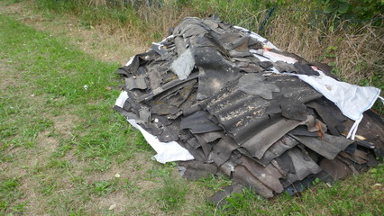 Asbestos. A pile of hazardous asbestos waste after a building demolition, ready for transport to the nearest disposal point.