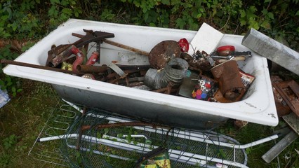  Scrap and old rusty metal waste, residual waste from the house demolition, ready for transport and recycling.