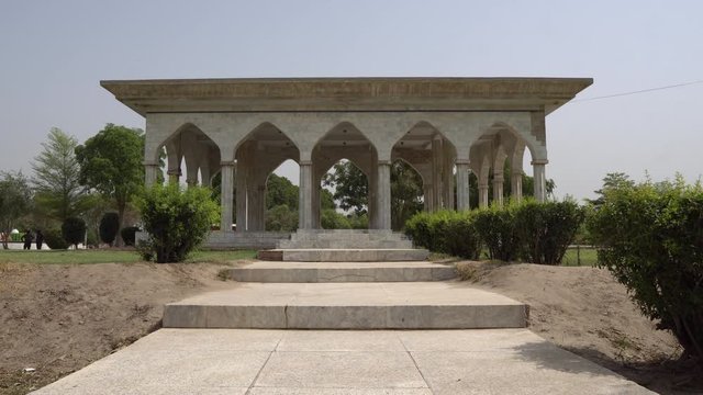 Multan Shah Shams Park Pavilion Low Angle View at Eidgah Road with Clipped Hedges on a Sunny Blue Sky Day
