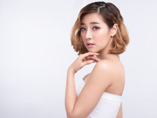 Beauty Young asian woman with perfect facial skin. Gestures for advertisement treatment spa and...