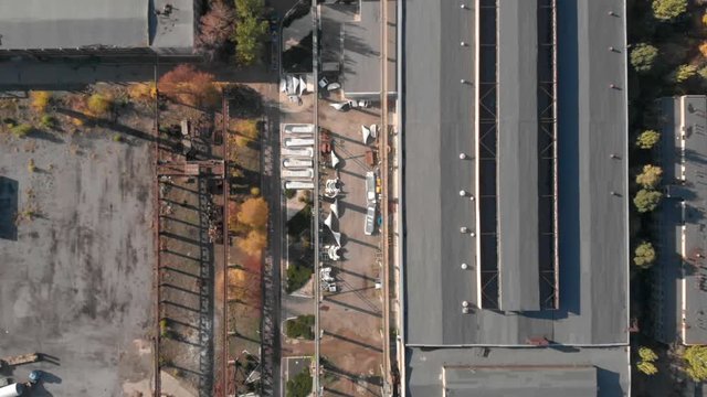 Old soviet factory plant big rusty hangar. Aerial footage, top view