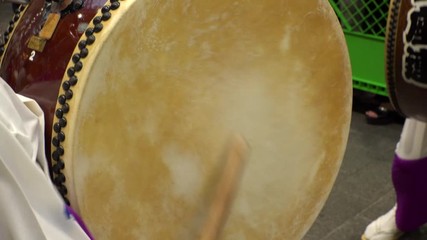 KOENJI, TOKYO, JAPAN - 24 AUGUST 2019 : Close up shot of beating Japanese drum at AWA ODORI FESTIVAL (AWA DANCE FESTIVAL) in Koenji. Slow motion shot.