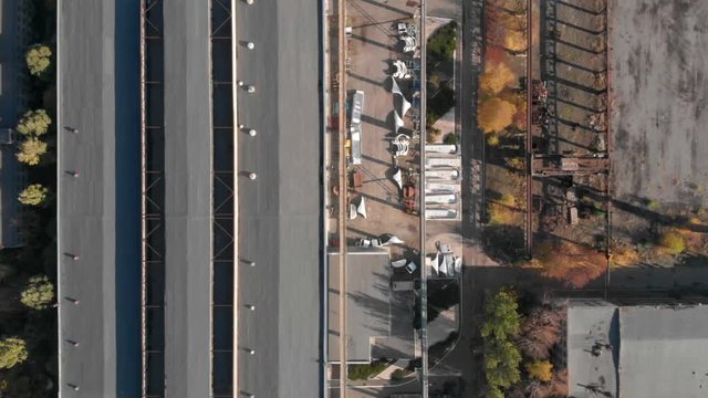 Old soviet factory plant big rusty hangar. Aerial footage, top view