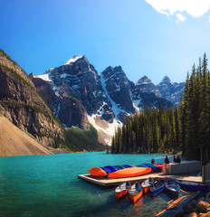 Canoes on a jetty at Moraine lake in Canada