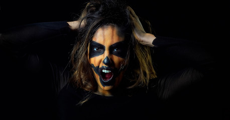 portrait of a woman dressed as halloween pumpkin