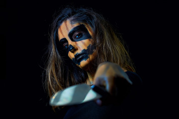 portrait of a woman dressed as halloween pumpkin