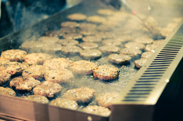 preparing tasty grilled hamburgers