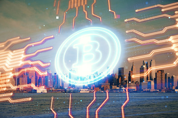 Double exposure of crypto currency theme hologram drawing and city veiw background. Concept of...
