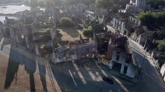 Aerial view of the Oradour Sur Glane war memorial. Hundreds of civillians were massacred by the German SS during world war 2.
A fork in the road with the church visible in the background.