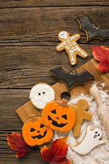 Evil halloween cookies on a wooden background