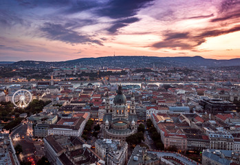 Fototapeta na wymiar Budapest, Hungary - Aerial view about the towers of the famous St.Stephen's Basilica and Buda Castle, Chain Bridge, Matthias Church at cloudy sunset