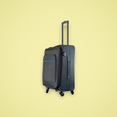 Black suitcase isolated on beautiful pastel color background, with clipping path.