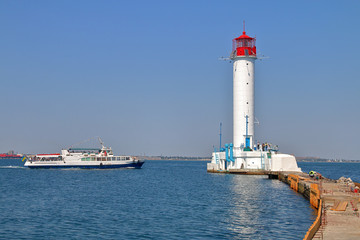 Pleasure boat sailing near the Odessa lighthouse.