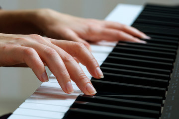 Young woman playing piano