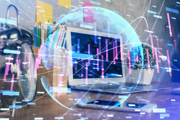 Double exposure of chart and financial info and work space with computer background. Concept of international online trading.