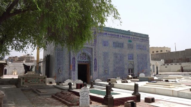 Multan Darbar Hazrat Yousaf Shah Gardez Tomb Graves with Cleaning Man Side View on a Sunny Blue Sky Day