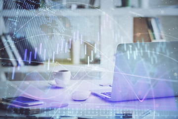 Forex market chart hologram and personal computer background. Double exposure. Concept of investment.