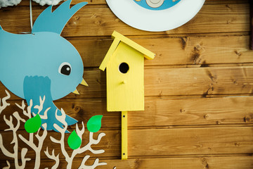 colored birds on a wooden background