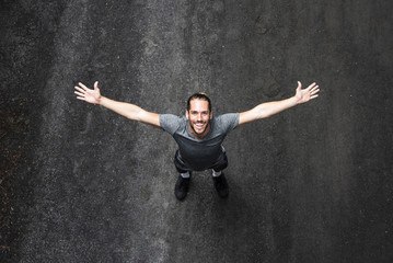Top view of man with arms wide open