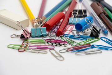 Colorful office tools set, pen, binder, paper clip, pencils, eraser isolated on white background