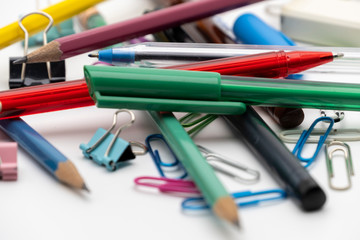 Colorful office tools set, pen, binder, paper clip, pencils, eraser isolated on white background