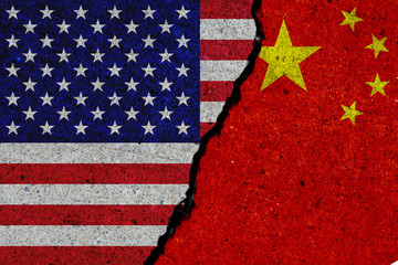 united states and china flags painted over cracked concrete wall