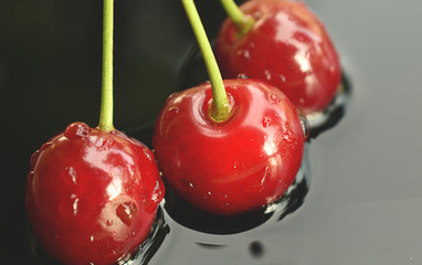 cherry on a black background, healthy food