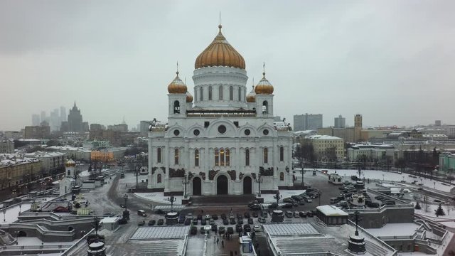 Flying backwards from the Cathedral of Christ the Saviour in winter Moscow, Russia. Second tallest Orthodox Christian church in the world