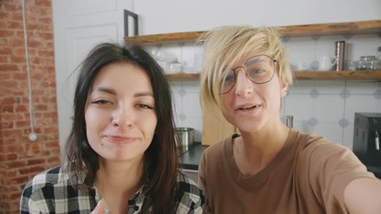 Lesbian couple taking selfie