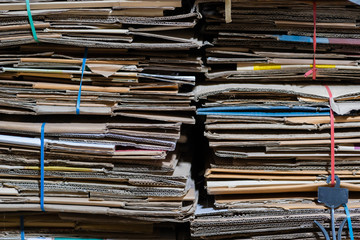 Stack of paper and cardboard waste before shredding at the recycle plant for environment