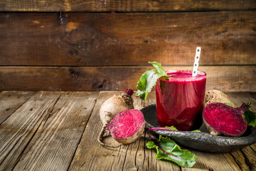 Vegan healthy diet drink. Beetroot detox juice or smoothie, on rustic wooden table with copy space