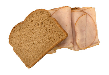 Thin sliced smoked turkey sandwich on a white background