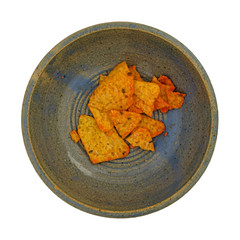 Cheese flavored tortilla chips in a bowl on a white background