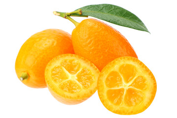 Cumquat or kumquat with slices and leaves isolated on white background