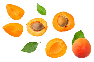 apricot fruits with slices and green leaf isolated on white background. top view