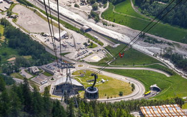 Elevated view from a cabin of the Skyway Monte Bianco cable car of Courmayeur / The Valley station (1300m) in summer, Courmayeur, Aosta, Aosta Valley, Italy