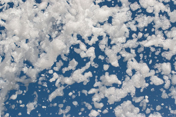 white foam on a blue background