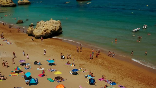Wide elevated view of the Dona Ana beach in Lagos, The Algarve, Portugal, with beautiful rock formations and turquoise waters