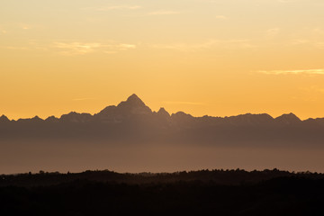 Monviso silhouette in sunset sky