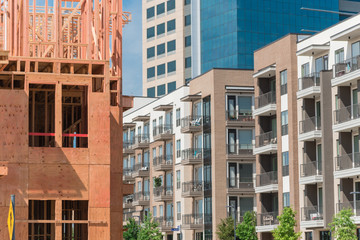Luxury wooden urban apartment complex near completed buildings in Dallas
