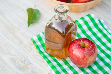 Apple cider vinegar in a bottle. Selective focus.