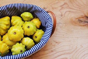 Yellow summer squash wooden background