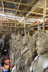 Clay idol of Goddess Devi Durga is in preparation for the upcoming Durga Puja festival at a pottery...