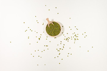 Assortment of beans and lentils in wooden bowl and spoon on clear background. mung bean, groundnut,...