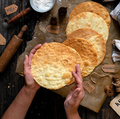 overhead shot of tasty crispy baked round puff pastry layers of homemade traditional Russian...