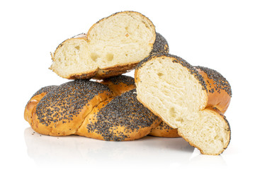 Group of one whole two halves of twisted poppy seed bun isolated on white background